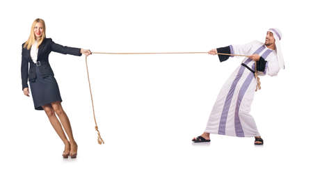 Woman pulling rope on whiteの写真素材