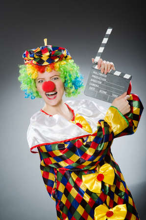 Clown with movie clapper in funny conceptの写真素材