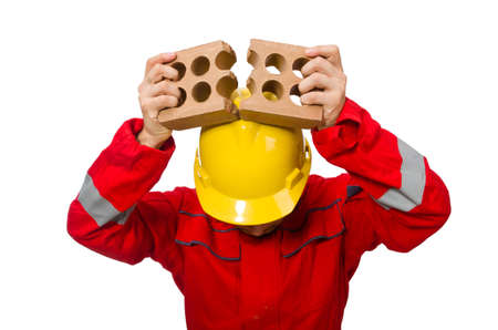 Construction worker with clay bricks on white