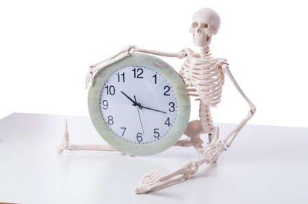 Skeleton with clock isolated on white