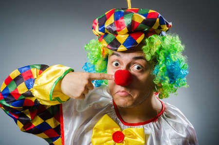 Funny clown in comical concept
