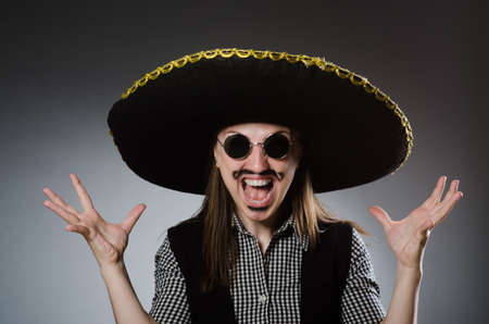 Person wearing sombrero hat in funny conceptの写真素材