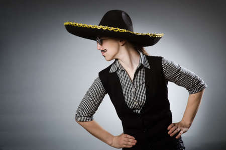 Person wearing sombrero hat in funny conceptの写真素材
