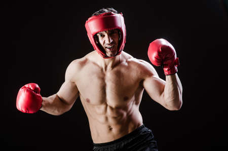 Muscular man in boxing conceptの写真素材