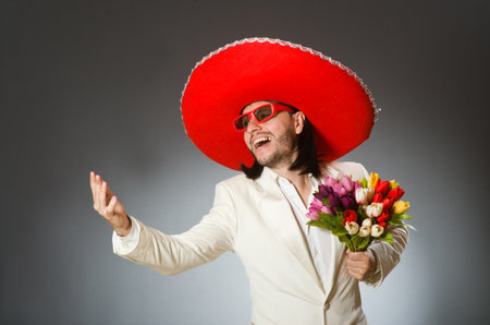 Person wearing sombrero hat in funny conceptの写真素材