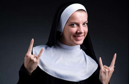 Funny nun showing victory signの写真素材