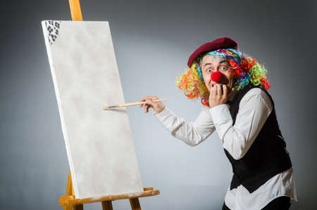 Funny artist in dark studioの写真素材