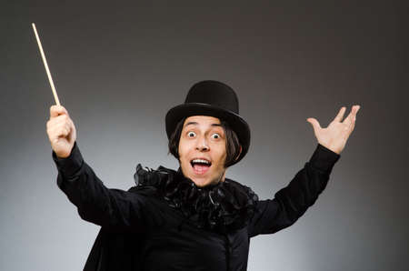 Funny magician wearing cylinder hatの写真素材
