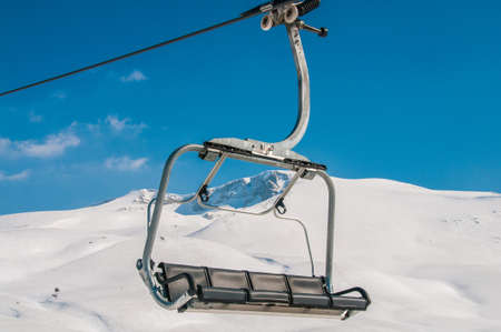 Ski lifts durings bright winter day