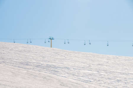 Ski lifts durings bright winter day