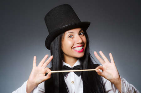 Woman magician in funny concept