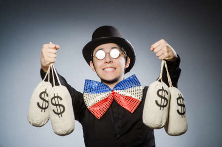 Funny man with money dollar sacksの写真素材