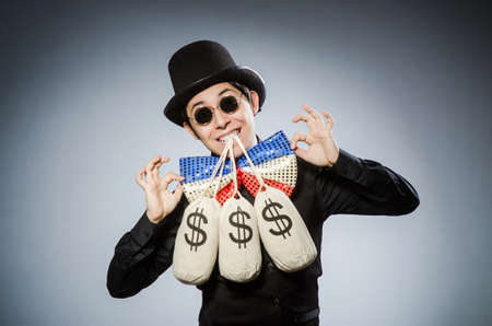 Funny man with money dollar sacksの写真素材