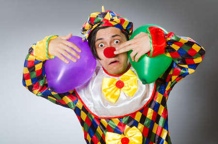 Clown with balloons in funny concept