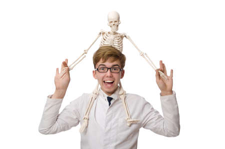 Funny doctor with skeleton isolated on whiteの写真素材
