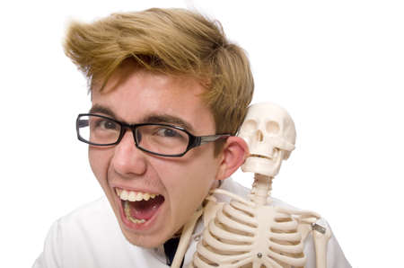 Funny doctor with skeleton isolated on whiteの写真素材