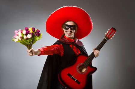 Man wearing sombrero in dark studioの写真素材