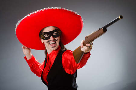 Person wearing sombrero hat in funny conceptの写真素材