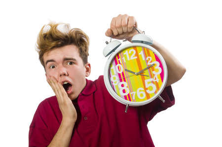 Student holding alarm clock isolated on whiteの写真素材