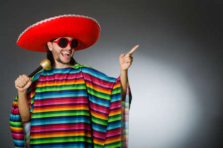 Man wearing sombrero in dark studioの写真素材