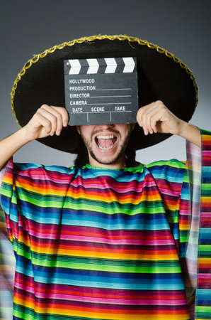 Mexican man with movie boardの写真素材