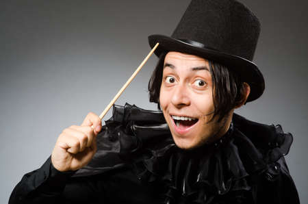 Funny magician wearing cylinder hatの写真素材