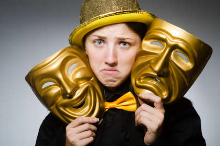 Woman with mask in funny conceptの写真素材