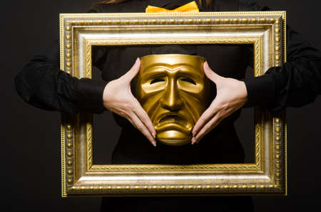 Woman with mask in funny conceptの写真素材