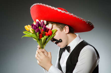 Person wearing sombrero hat in funny conceptの写真素材