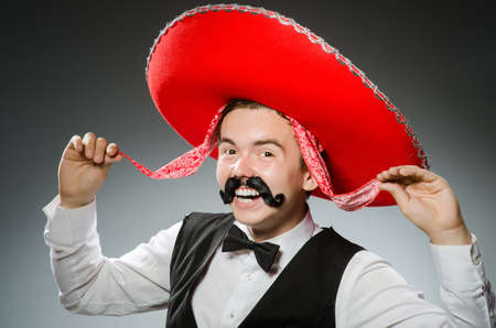 Person wearing sombrero hat in funny conceptの写真素材
