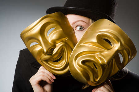 Woman with mask in funny conceptの写真素材