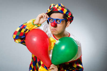 Clown with balloons in funny conceptの写真素材