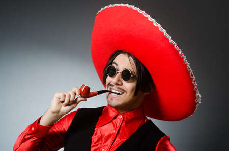 Person wearing sombrero hat in funny conceptの写真素材