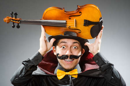 Funny violin player wearing tophatの写真素材
