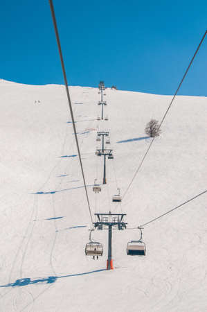 Ski lifts durings bright winter day