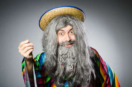 Person wearing sombrero hat in funny conceptの写真素材