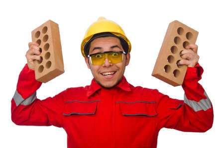 Construction worker with clay bricks on whiteの写真素材