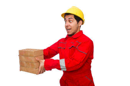 Construction worker with clay bricks on white