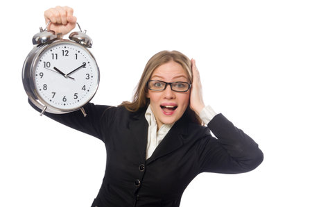 Pretty office employee with alarm clock isolated on whiteの写真素材