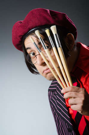 Funny artist with his artworkの写真素材