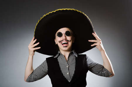 Person wearing sombrero hat in funny conceptの写真素材