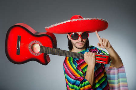 Mexican playing guitar wearing sombreroの写真素材