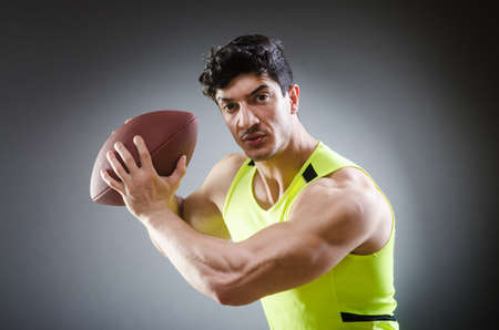 Muscular man with american football