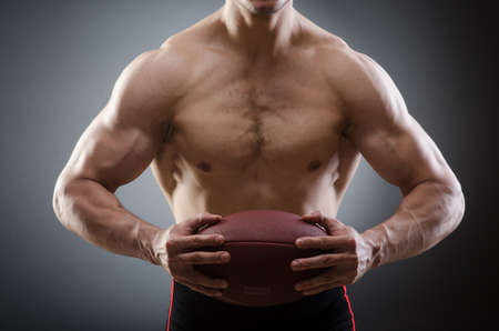 Muscular man with american football