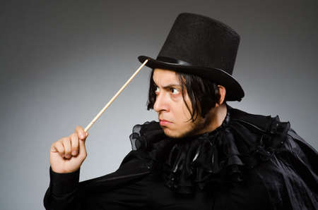 Funny magician wearing cylinder hatの写真素材