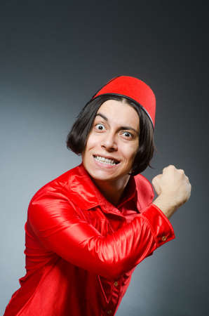 Man wearing red fez hatの写真素材