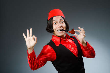 Man wearing red fez hatの写真素材