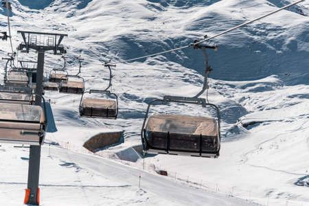 Ski lifts durings bright winter day