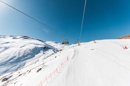 Ski lifts durings bright winter day