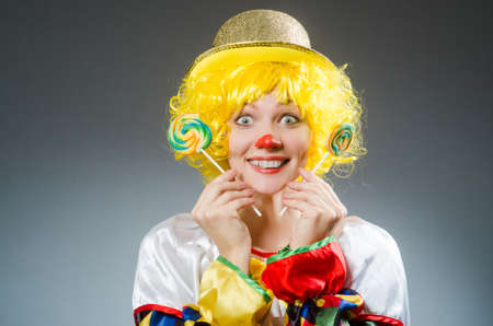 Clown in funny concept on dark backgroundの写真素材